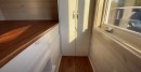 Custom tiny house is packed with functionality and surprise features