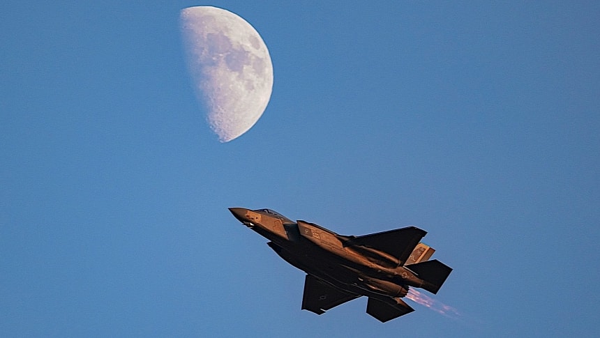F-35A Lightning II flying under the Moon during air show