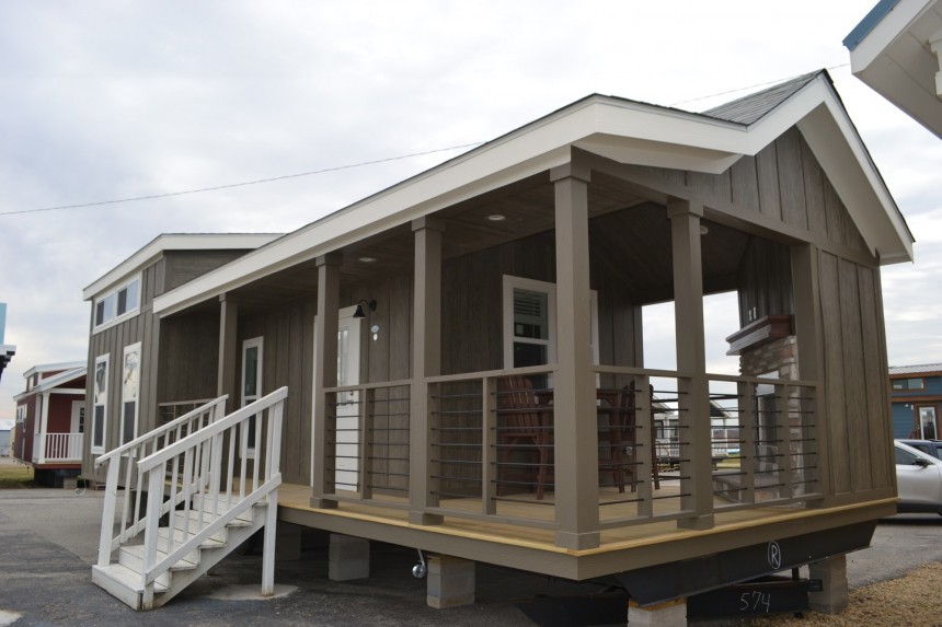 The Zircon tiny house boasts a fireplace on the porch and an XL kitchen