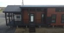 The Zircon tiny house boasts a fireplace on the porch and an XL kitchen